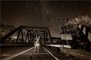 BW version: Woman with shotgun on the Cooks Valley Bridge at the Humboldt County Line