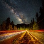 Nighttime view down US 101 with taillight streaks and the Milky Way.