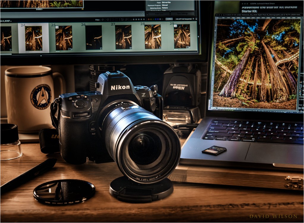 The Art 35 Photo Assistant custom GPT full avatar image: Camera and computer gear mugging for a photo on my desk top. This is the Art 35 Photo Assistant (A35PA) custom GPT full avatar image. 